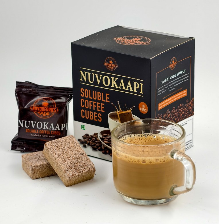 Nuvokaapi soluble coffee cubes box, sachet, cubes and a cup of coffee